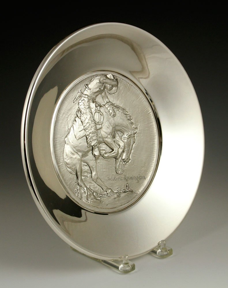 Frederic Remington Washington Mint Plate: Frederic Remington Washington Mint commemorative plate, sterling silver, limited edition, numbered 6529, 10" dia, approximately 22.3 troy oz total weight. Provenance: from the lifelong collection of a