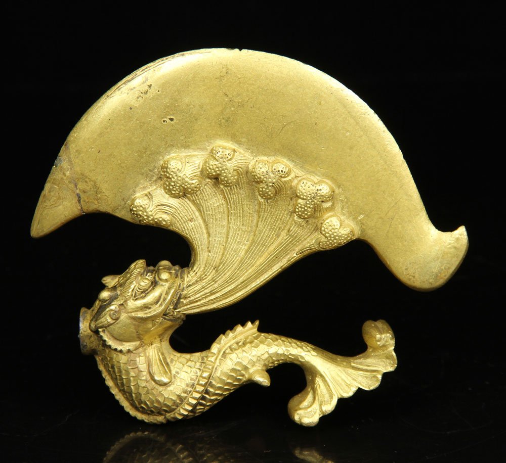 Chinese Bronze Axe Head: Chinese axe head, gilt bronze, having a serpent motif, 5" h. Provenance: from the lifelong collection of a Kansas City, Missouri family.