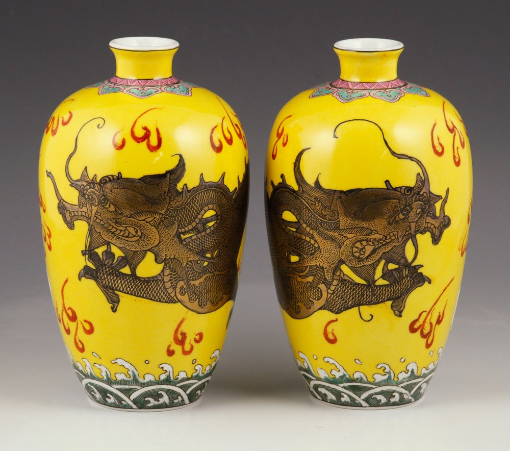 Two Chinese Yongzheng Vases: Two Chinese Yongzheng vases, porcelain with silver overlay, decorated with five claw dragons on yellow field, 8 3/4" h. Provenance: from the lifelong collection of a Kansas City, Missouri family.