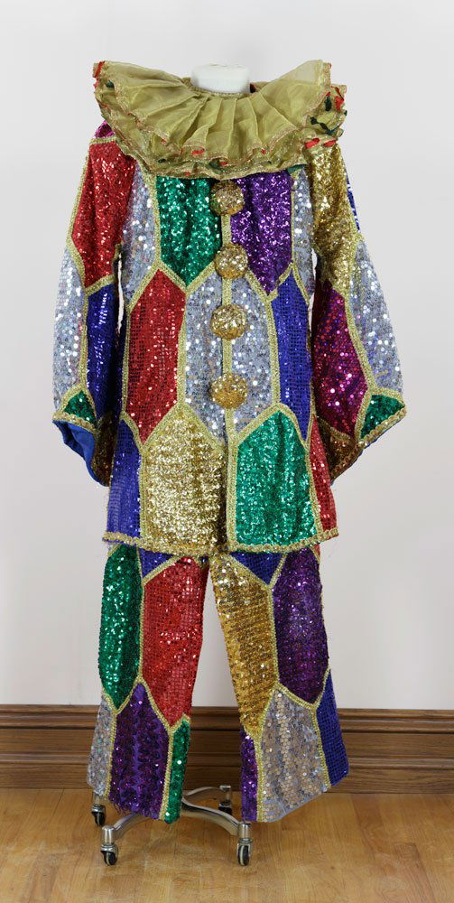 Multicolored Sequined Jester Costume: Multicolored sequined jester costume, with gold ruffled color, worn by various magic company characters including Albert Ping Pong (Rick Heath). Provenance: From White Horse Productions, Inc. For cond