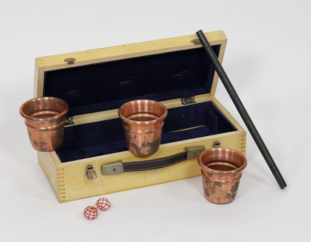 "The Phoenix" Cups and Balls: "The Phoenix" cups and balls, (1 of 1000 sets), based on Ron Bertian and Charlie Miller, comes with lined wooden case, 4" h x 14" w x 6" d. Provenance: From Marco's (Cesareo R. Pelaez) private collect