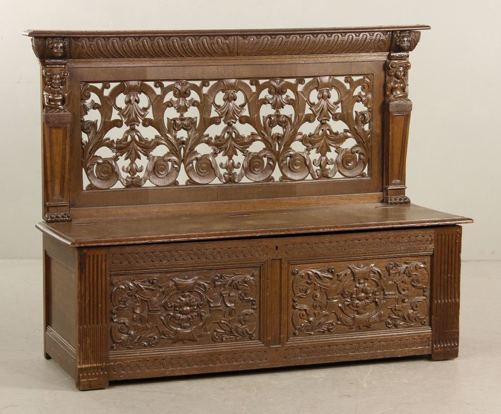 19th C. English Bench: 19th century English lift-top bench, having carved posts and back, 42" h x 55" w x 19" d. Provenance: from the home of a retired professional woman who lived in London, England during World War II.