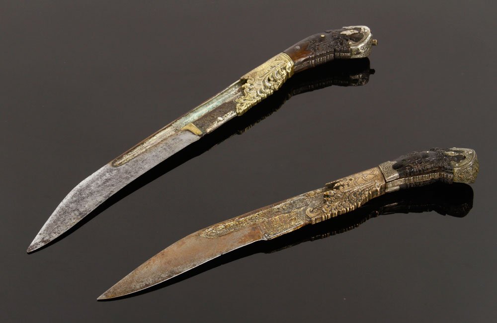 Pr. Sri-Lankan Piha Kaetta: Pair of Sri-Lankan Piha Kaetta, one large, one small, both with ornate brass and silver trim, larger has intricately engraved silver inlay on blade, both with fitted cases; over two-hundred years old,