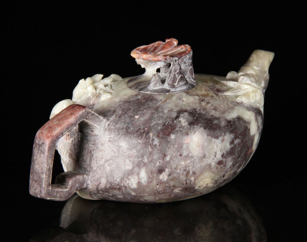 Chinese Soapstone Teapot: Chinese teapot, soapstone, carved in high relief with images of bamboo and leaping deer, with carved bat finial, 2 1/2" h. Provenance: From a New Hampshire estate.