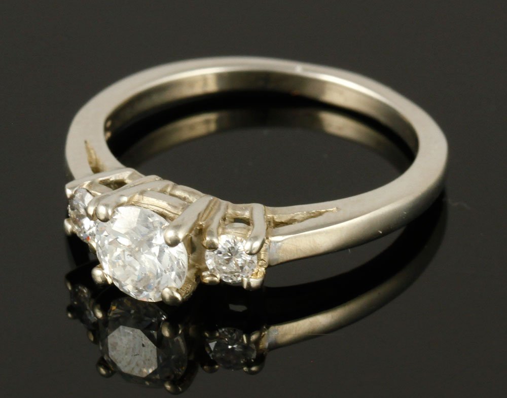 14K White Gold and Diamond Engagement Ring: Ladies' 14K white gold and diamond engagement ring, center stone approximately .40 CT, two small stones .08 CT, approximately 2 grams TW, size 5 1/2.