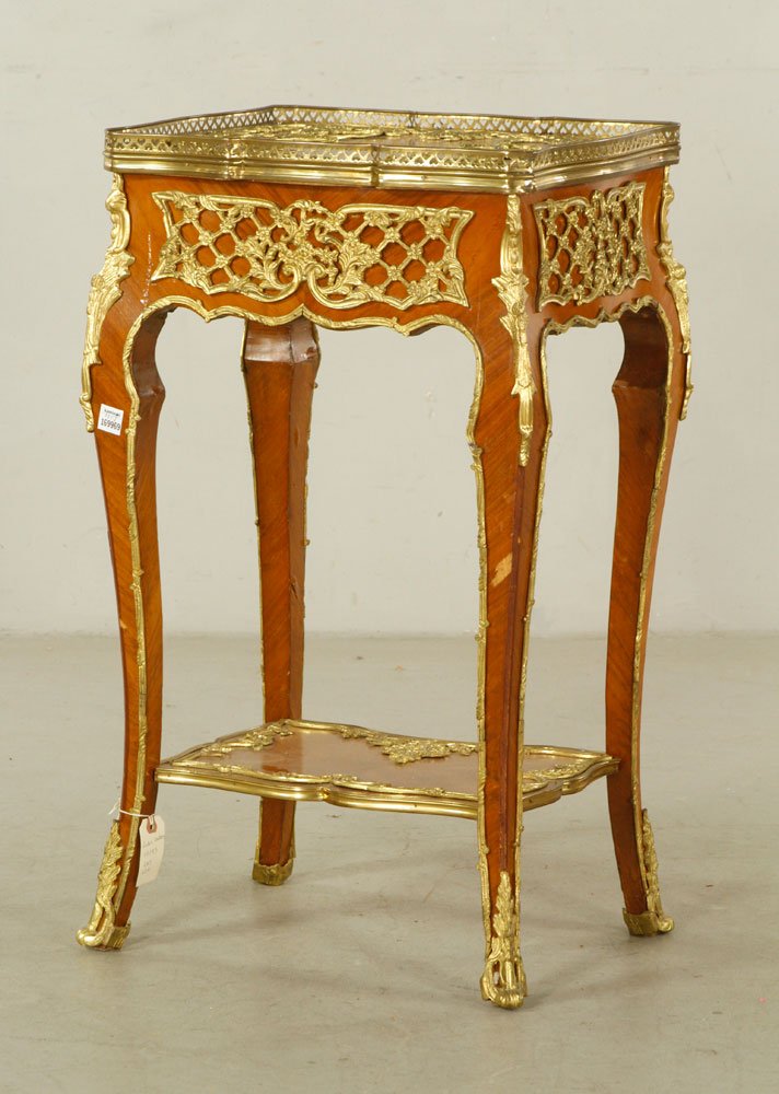 20th C. French Lamp Table: Lamp table with gallery top, French, 20th century, with ormolu mounts and single low shelf, 32" h x 18 3/4" l x 15 1/2" w. Provenance: From a Massachusetts estate.