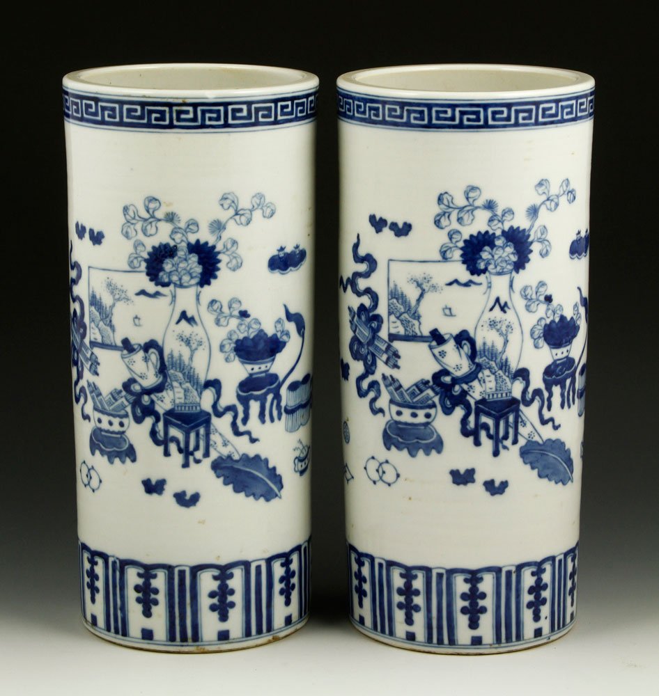 Pr. Chinese Blue and White Hat Stand Vases: Pair of blue and white porcelain hat stand vases, China, painted with vases, screen, scrolls, books, and stools, Guangxu mark on base, 11 1/4"h.