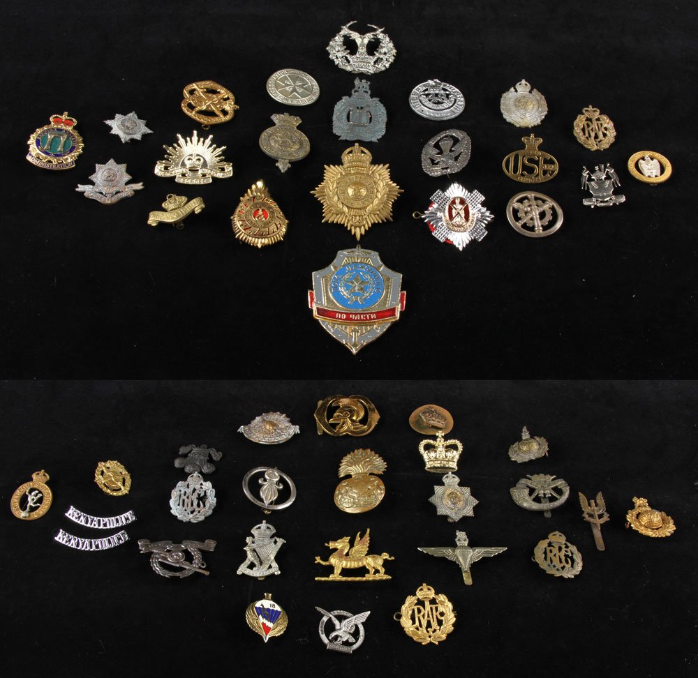 Lot of British Military Insignia: Lot of British military insignia. Provenance: From the estate of film, television and stage performer Raymond Kyle-Koscuik. Originally from New York, Kyle settled in West Hollywood, California during
