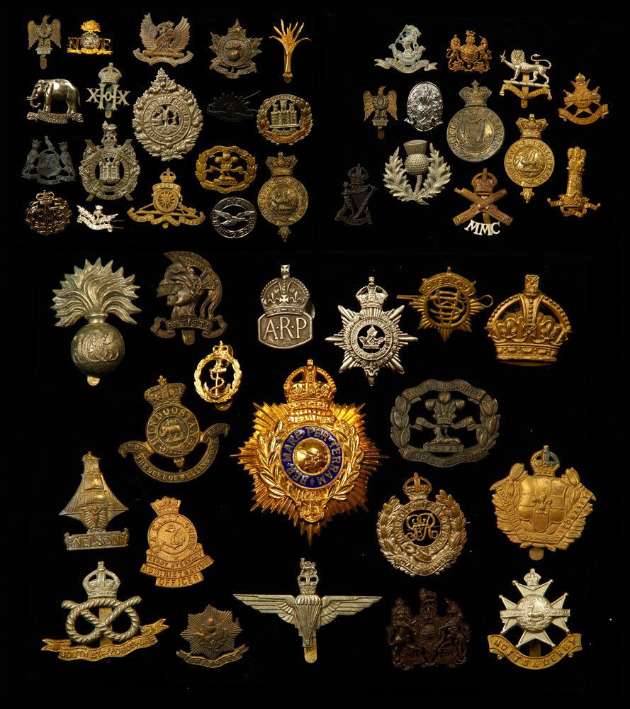 Lot of British Military Insignia: Lot of British military insignia. Provenance: From the estate of film, television and stage performer Raymond Kyle-Koscuik. Originally from New York, Kyle settled in West Hollywood, California during