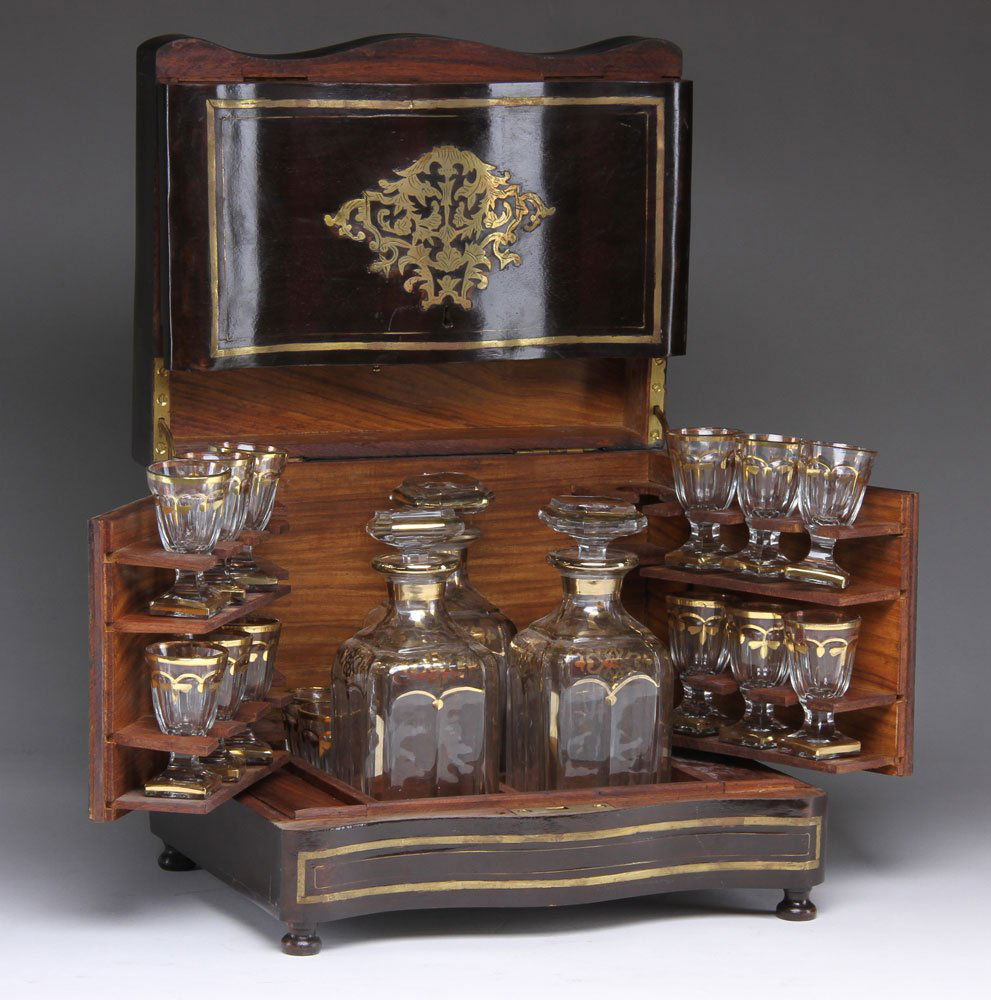 19th C. Rosewood Tantalus Set: Rosewood tantalus, 19th century, inlaid with brass, to include: three decanters (7 5/8" h) and sixteen cordial glasses (3" h), all with gilt decorations; case measuring 10 3/8" h x 12" w x 9" d, with