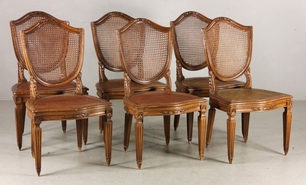 Set of 6 Louis XVI Style Chairs: Set of six Louis XVI-style side chairs, beachwood, with shield backs and caning, on fluted tapered legs, circa 1890, 37" h x 21" w x 23" d. Provenance: From the collection of Gilbert Pelham, former Ma