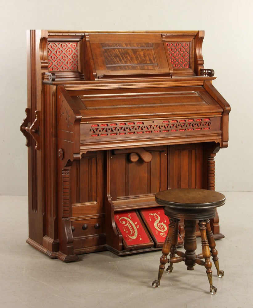 Kimball Victorian Walnut Pump Organ: Kimball of Chicago East Lake Victorian walnut pump organ, including swivel stool, 52" h x 45" w x 23 1/2" d, in working condition. Provenance: From the personal lifetime collection of Mark Avner of La
