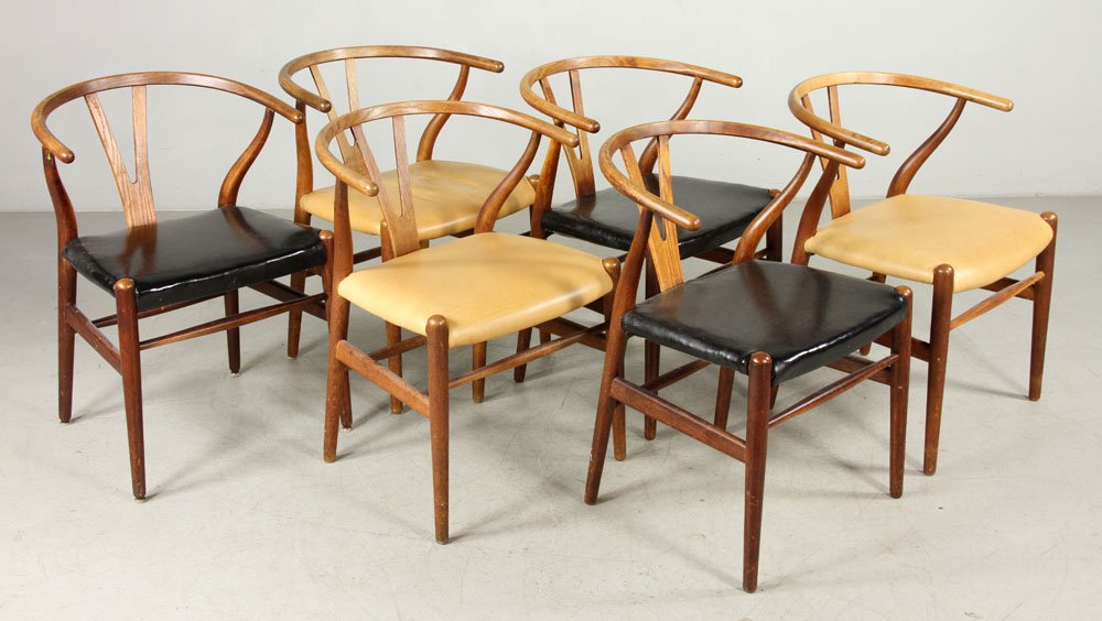 Six Hans Wegner Wishbone Chairs: Hans Wegner (Danish, 1914-2007), set of six Wishbone chairs, re-upholstered, partial signature visible "Carl Hansen & Son Odense Denmark," 28 3/4" h x 21 3/4" w x 22" d. Provenance: From a Massachuset