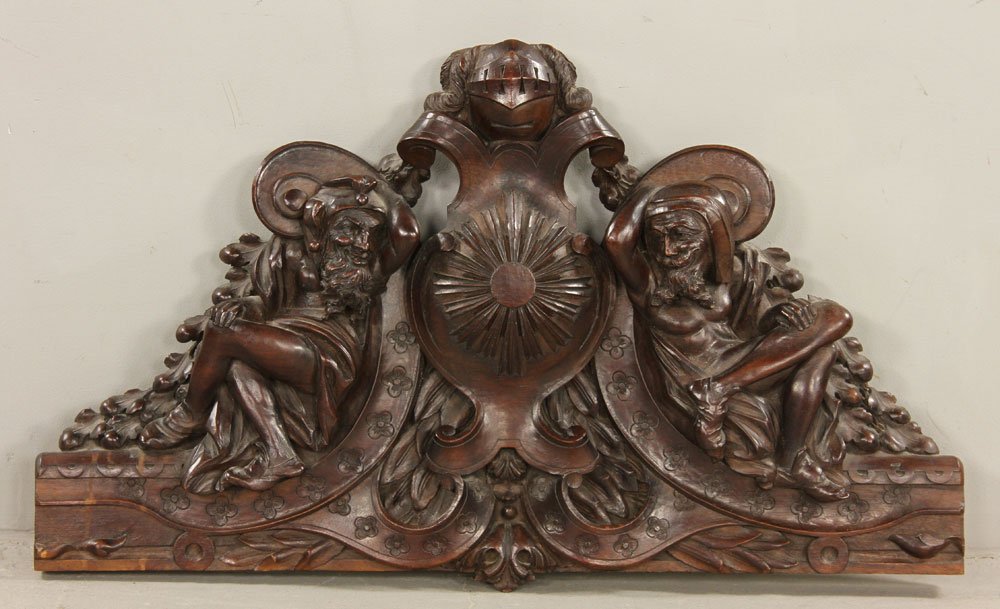 Italian Carved Walnut Crest: Italian carved walnut crest, decorated with suit of armor helmet, 20" h x 32" w. Provenance: From the personal lifetime collection of Mark Avner of Lake Worth, FL and Buffalo, NY.