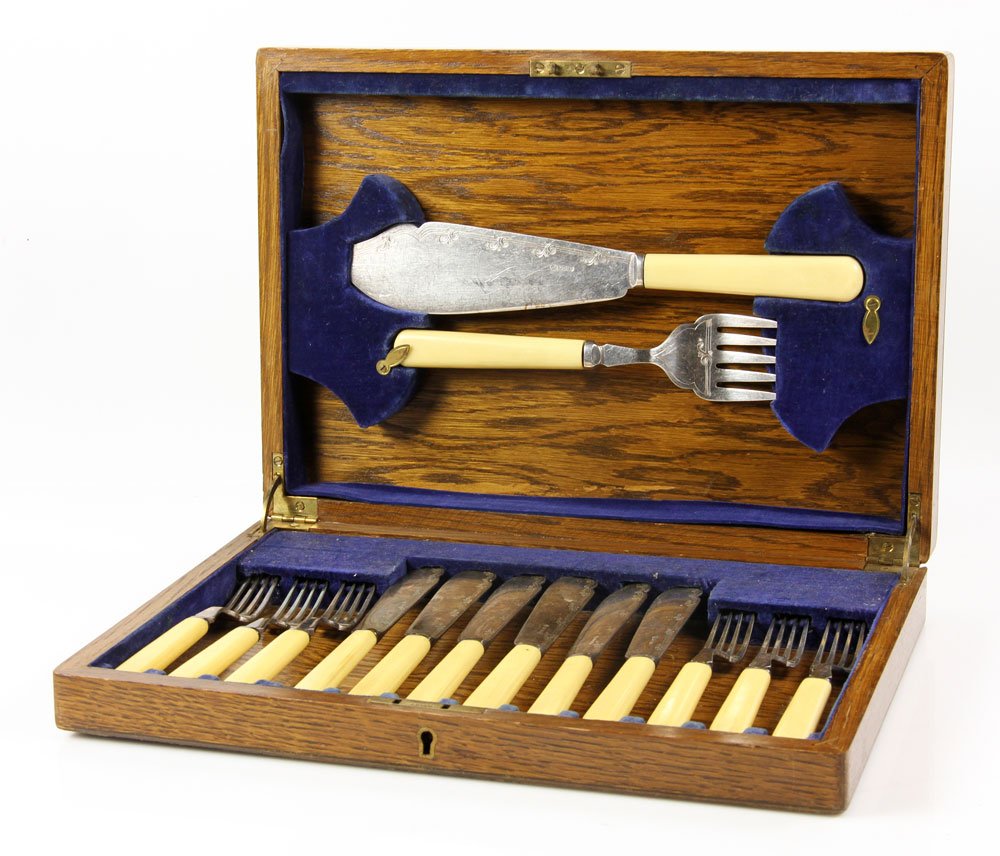 Set of English Fish Servers: English fish serving knife and fork, with wooden case. Provenance: From the home of a retired professional woman who lived in London, England during World War II.