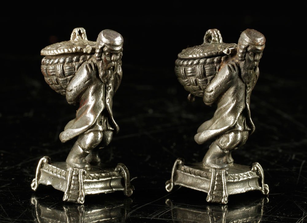 Pair of Figural Judaica Incense Burners: Pair of Russian figural Judaica incense burners, depicting Hassidic elders holding baskets, hallmarked "84" for .875 silver, 2 1/2" h. Provenance: from a Connecticut estate.