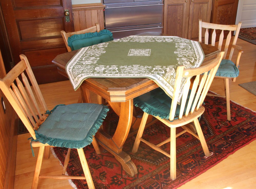 Trestle Table and Four Chairs: Trestle table with three side chairs and one armchair, circa 1920's, 30 1/2" h x 44" l x 31 1/2" d (table).