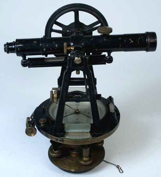 C1925 Brass Theodylite Transit by Buff & Berger: Circa 1925 theodylite transit with singed label 'Buff and Berger, Boston, Mass #1124'. Body of instrument is painted black. Dimensions: 14"H x 7"D. Condition: some paint loss.