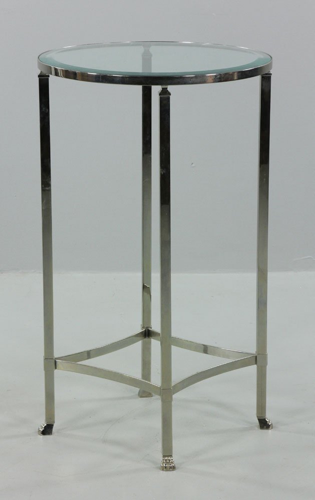 Philippe Starck Stainless Steel Table: Philippe Starck table, stainless steel with beveled glass top, made in Argentina, 33 1/2" h x 20" dia. Provenance: From an Argentina estate.