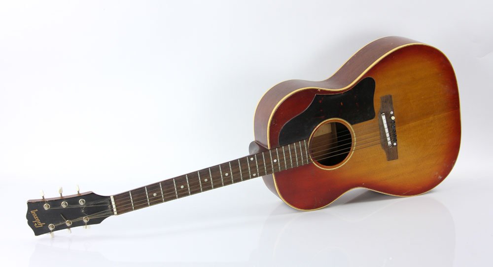 Gibson Acoustic Guitar: Gibson acoustic guitar, sunburst finish, rosewood neck with mother of pearl inlay, serial number 50609. Provenance: From a Massachusetts estate.