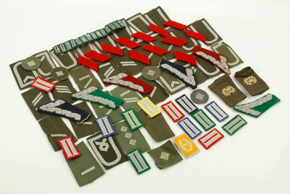 Lot of German Military Insignia: Lot of German military insignia. Provenance: From the estate of film, television and stage performer Raymond Kyle-Koscuik. Originally from New York, Kyle settled in West Hollywood, California during t