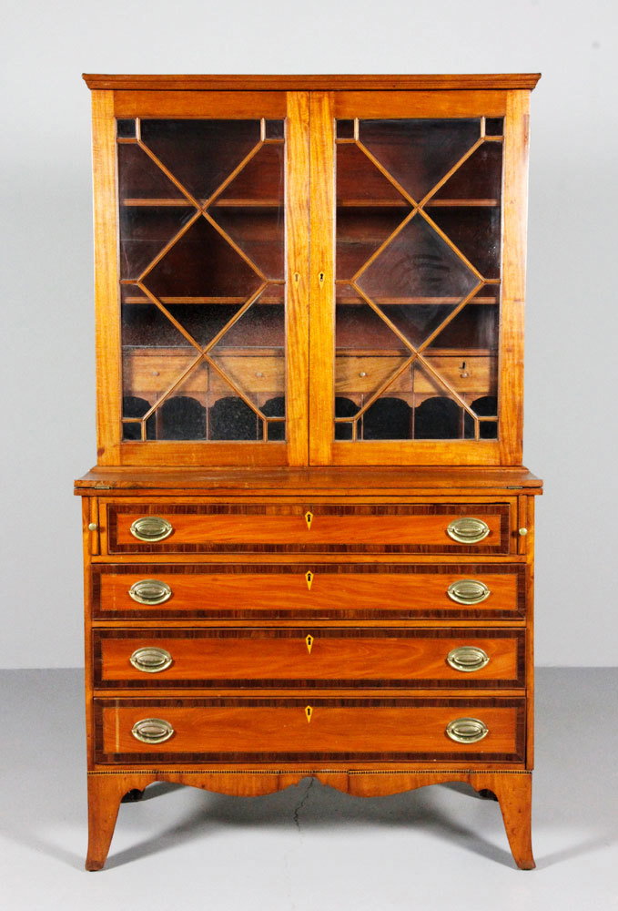Federal Hepplewhite Butler's Secretary: Federal Hepplewhite butler's secretary desk, circa 1790, cherry wood with rosewood cross banding on drawers, string inlay and bone escutcheon inlay, top with three shelves over four drawers above eigh