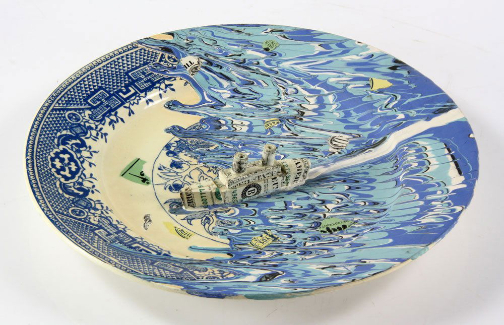 Shaw, Charger, Ceramic: Richard Shaw (American, 1941-), charger, ceramic, abstract design with raised boat made from US dollar bolls, 13 1/2" diameter. Provenance: from a Los Angeles, California estate.