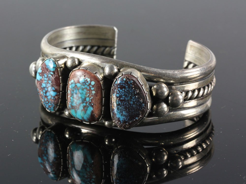 Navajo Sterling and Turquoise Cuff: Navajo cuff bracelet, sterling silver and turquoise, 79 grams total weight. Provenance: from the personal collection of Larry and Joy Redman of Lompoc, California.