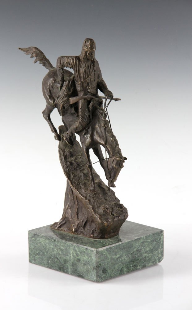 Remington Figural Bronze: Frederic Remington (American, 1861-1909), figural statuette, bronze, 12" high. Provenance: from the personal collection of Larry and Joy Redman of Lompoc, California.