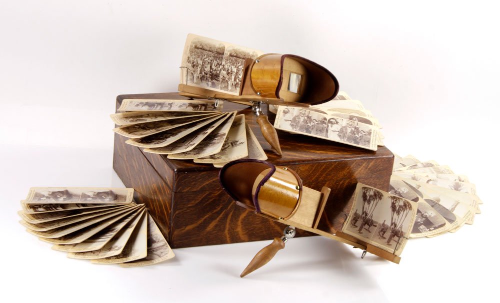 Holmes Stereoscopes with Case and Cards: Two Holmes stereoscopes with oak case and several hundred stereocards featuring scenes of Egypt, Palestine, Jordan, Russia and other foreign locations, 5 1/2" high x 15 1/2" wide x 13 1/2" deep (case)