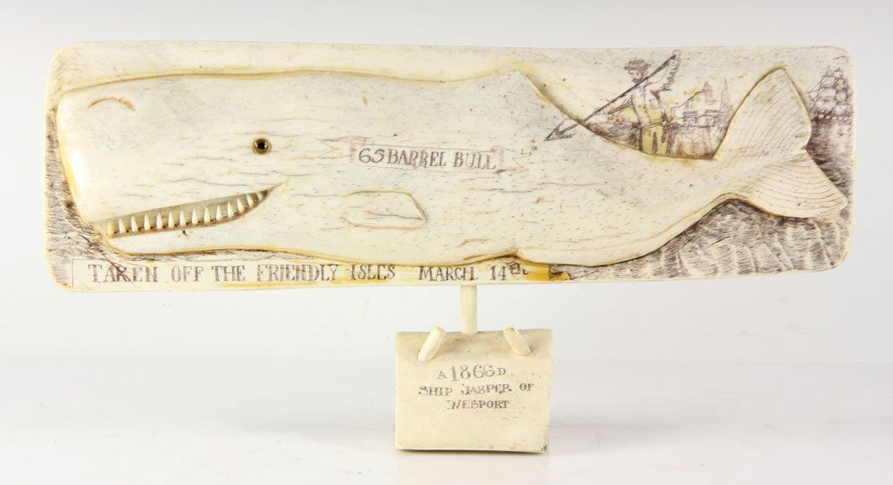 Folk Art Carved Whale: Maritime folk art whale, carved bone with scrimshaw decoration, glass eye, 7 1/4" high x 14 1/4" wide. Provenance: from the personal collection of Larry and Joy Redman of Lompoc, California.