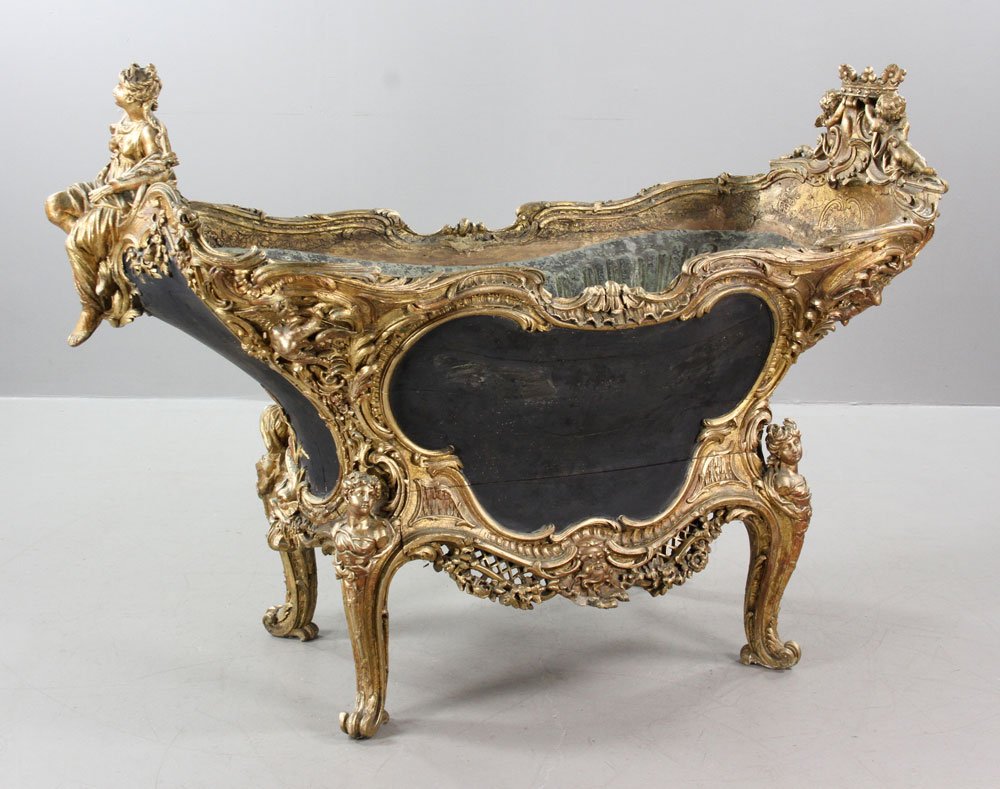 18th C. French Louis XV Basin: French Louis XV basin, 18th century, decorated with carved putti and figureheads, including copper liner with embossed center, 39 1/2" h x 58" l x 27" w. Provenance: From the Belvedere Guest House, Fi
