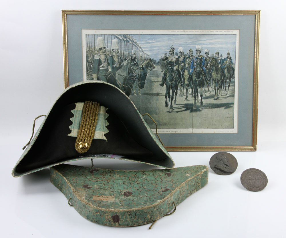 Lot of Military Items: Lot of military items, to include: antique Prussian military hat, seal skin, with maker's label inside, 8" h x 18" l x 10 1/2" w, in original hat box, with pair of gold embroidered epaulettes; silver 