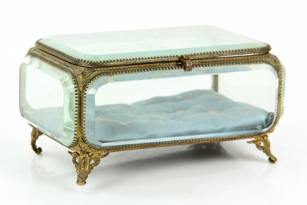 Brass Jewelry Casket: Brass jewelry casket, with beveled glass, 4" h x 7 1/4" w x 4 3/4" d.