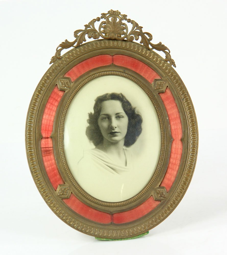 Bronze and Guilloche Enamel Frame: Bronze and guilloche enamel picture frame, with black and white photograph of a lady, 9" h x 6 3/4" w (overall).