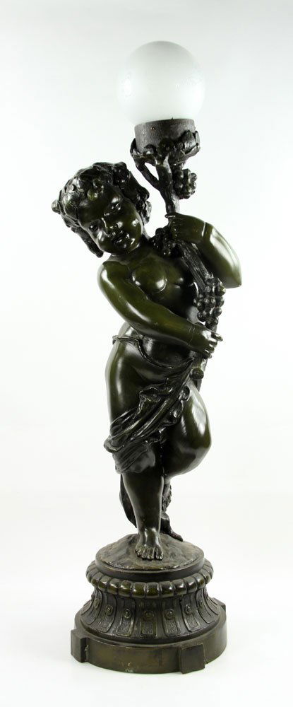 Moreau, Bacchante, Bronze Lamp: Auguste Moreau (French, 1834-1917), bronze lamp, depicting a bacchante holding a torch entwined with grape vines, base signed, with glass globe shade, 38" h x 9" w.