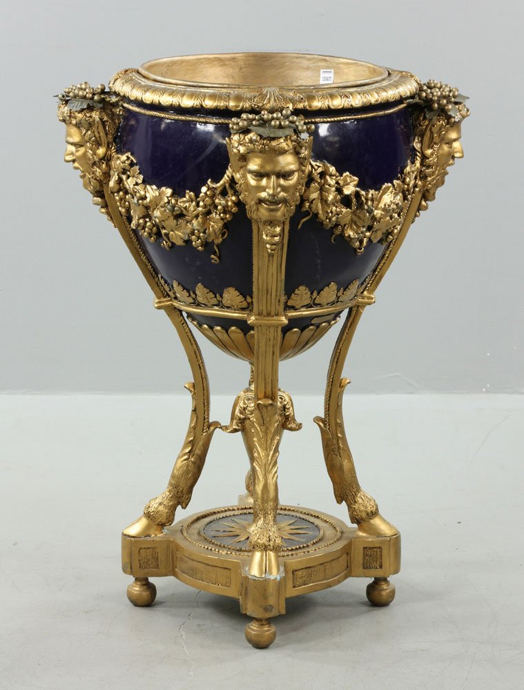 Classical Bronze Wine Cooler: Classical bronze wine cooler, gold decorated with Bacchus and grape vine motif, on cloven feet, with removable liner, 36" h x 26 1/2" dia.