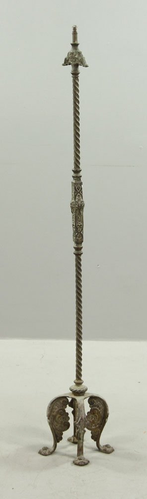 Antique Medieval Style Bronze Floor Lamp: Antique medieval-style floor lamp, bronze, circa 1920's, with goat head motif and lion's paw feet, not wired, 53" h.