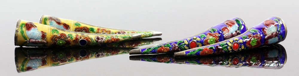 Two Prs. Chinese Finger Covers: Lot of two pairs of Chinese finger covers, one silver tone with yellow enamel design, the other with cobalt blue design, 3" l. Provenance: From a Florida estate.
