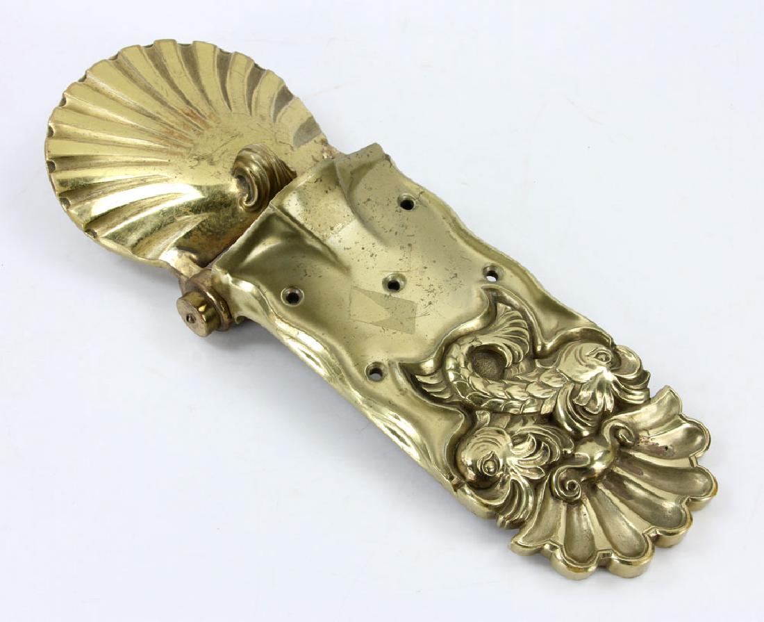 Brass Door Knocker: Door knocker, brass, in dolphin motif, 17 1/2" l. Provenance: from the estate of a prominent Massachusetts surgeon.
