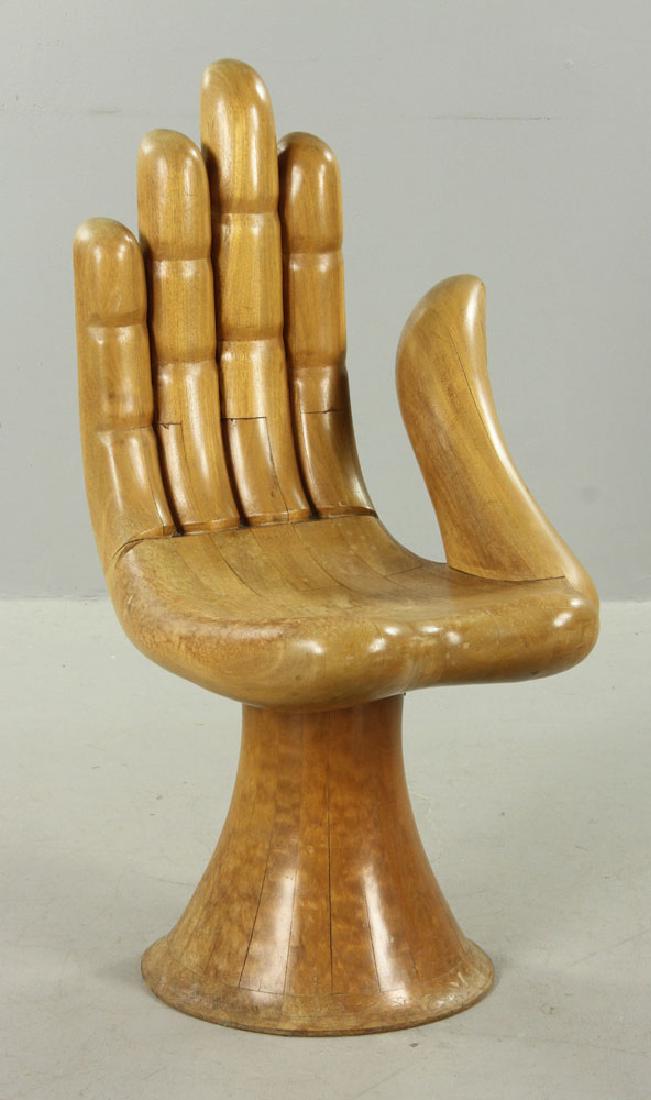Friedeberg Hand Chair: Pedro Friedeberg (Mexican, 1937-), sculptural hand chair, mahogany with original finish, signed inside the base by the artist, 36" high x 19" wide x 22" deep. Friedberg has shown works in museums incl