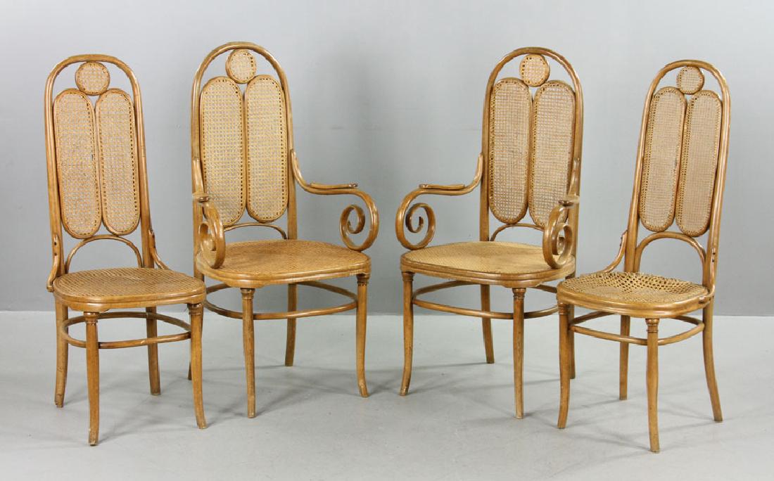 Four Thonet Bentwood Chairs: Four Thonet bentwood chairs, wicker, having two armchairs and two sidechairs, 45 1/2" high x 22 1/2" wide x 21 1/2" deep. Provenance: from a Los Angeles, California estate.