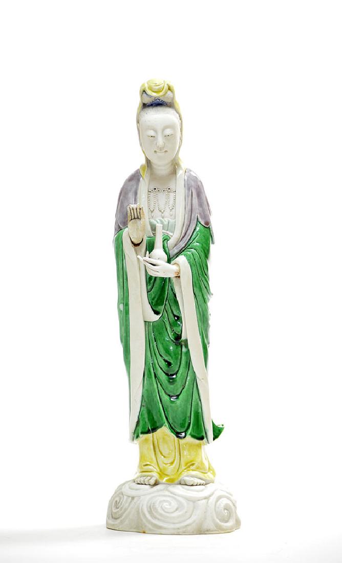 Chinese Famille Noire Figure of Guanyin: Chinese famille-noire figure of Guanyin, early 19th century, very finely molded and elegantly covered with bright yellow, green and aubergine glazes, 16" h; two finger tips missing on right hand.