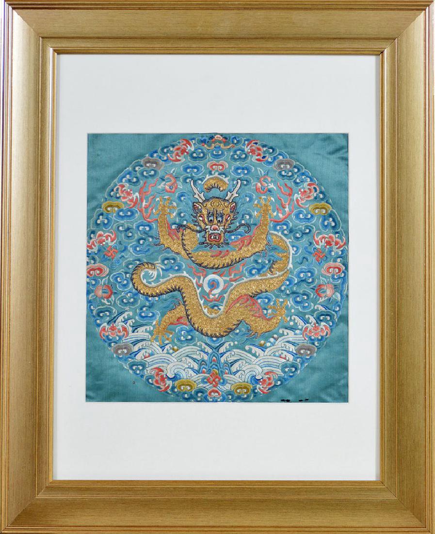 Silk Embroidered Dragon Roundel: Imperial silk embroidered dragon roundel, early 19th century, with couched gold thread depicting leaping, five-clawed, front-facing dragon protecting flaming pearl amidst flames and ruyi-shaped clouds
