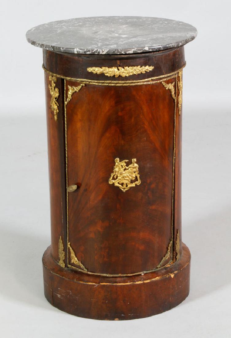 19th C. French Marble Top Vitrine: French pillar vitrine, 19th century, walnut with ormolu mounts and marble top, 26" h x 16" dia. Provenance: From a New York estate.