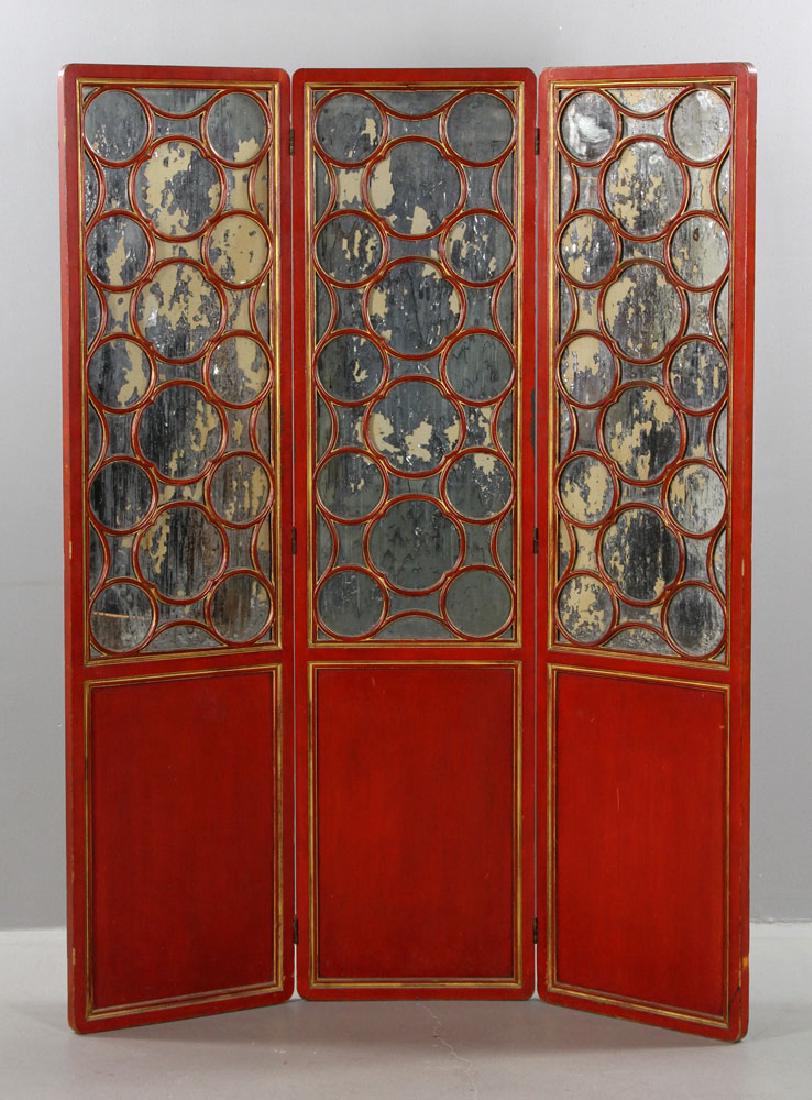 Mid Century James Mont Privacy Screen: James Mont three paneled privacy screen, red with gold trim, with distressed mirrored back panels to top portion, circa 1940s, 72" h x 55 1/2" w x 1 1/4" d. Provenance: From the lifetime collection of