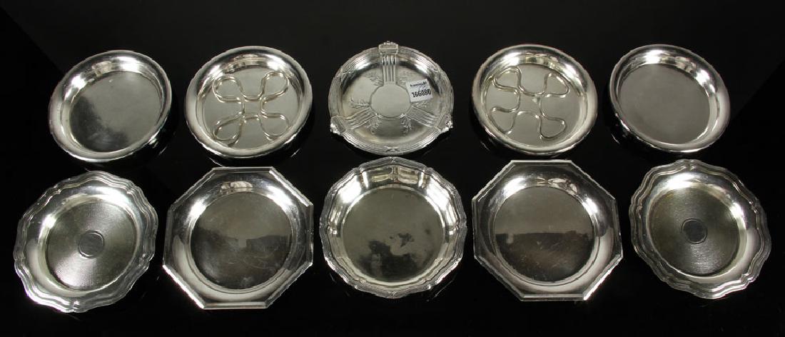 Lot of Silver Plate Wine Coasters: Lot of nine silver plate wine coasters, by Odiot, Gallia, C. Pillet Lyon, Orfet, Perie, Gallia and Brevete. Provenance: From a Santa Barbara, California estate.