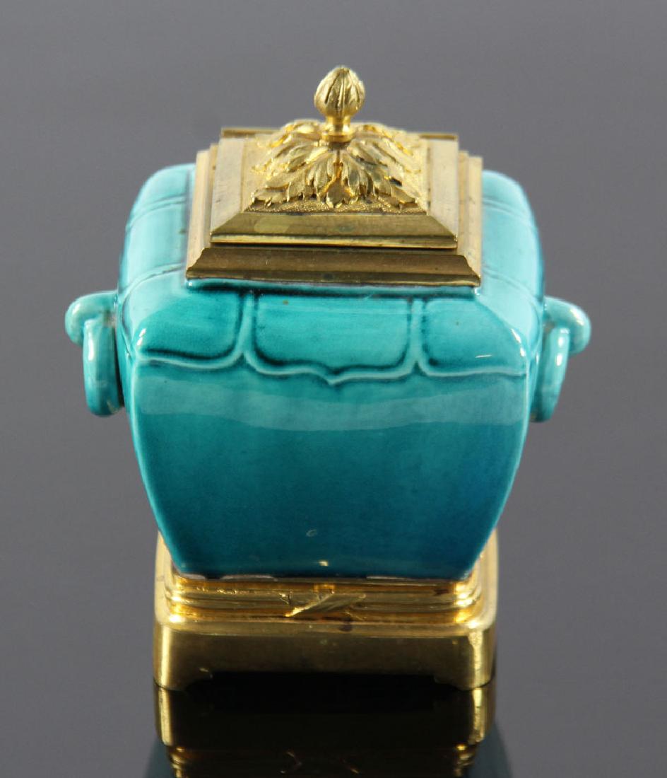 French Ormolu Mounted Inkwell: French porcelain inkwell, turquoise glaze with ormolu bronze mounts, 4 1/2" h x 3 1/2" w. Provenance: From a Santa Barbara, California estate.