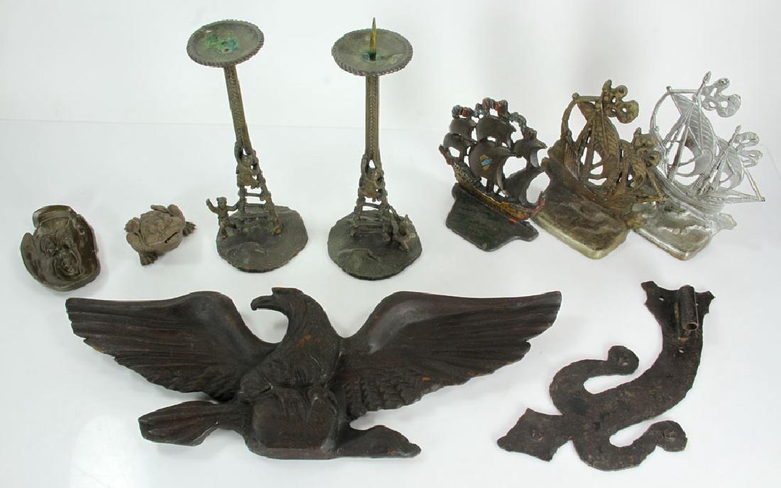 Lot of Miscellaneous Items: Lot of miscellaneous items, to include: cast iron doorstops, brass candlesticks, ash tray, and wood eagle. Provenance: From a California estate.
