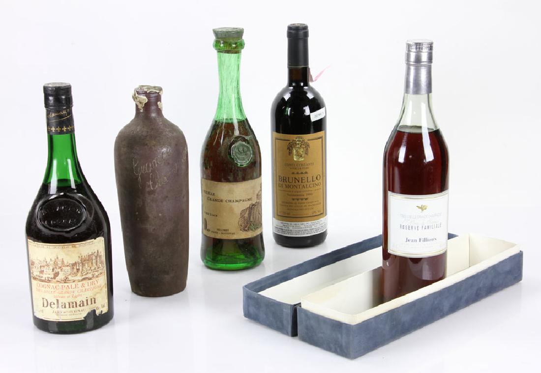 5 Bottles of Cognac: Lot of five bottles of rare cognac, to include: Delamain, Vieille (Brunello Vendemmia), Jean Fillioux, Res. Familiale, and one unknown in pottery bottle. Provenance: From the collection of Nina del Be